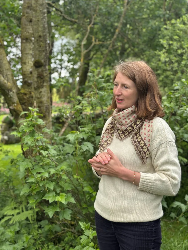 Photograph of Alice Foxley taken in the garden of Little Sparta in 2025